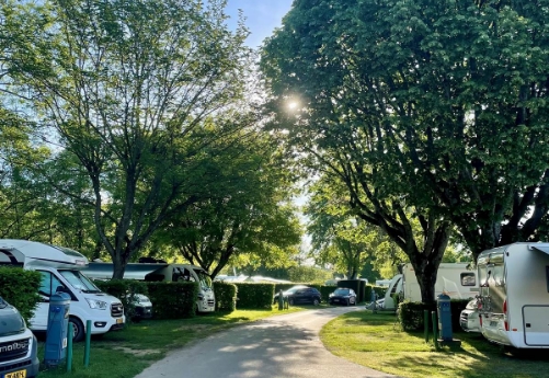 The driveway of Le Paquier Fané campground with a view of the RV sites