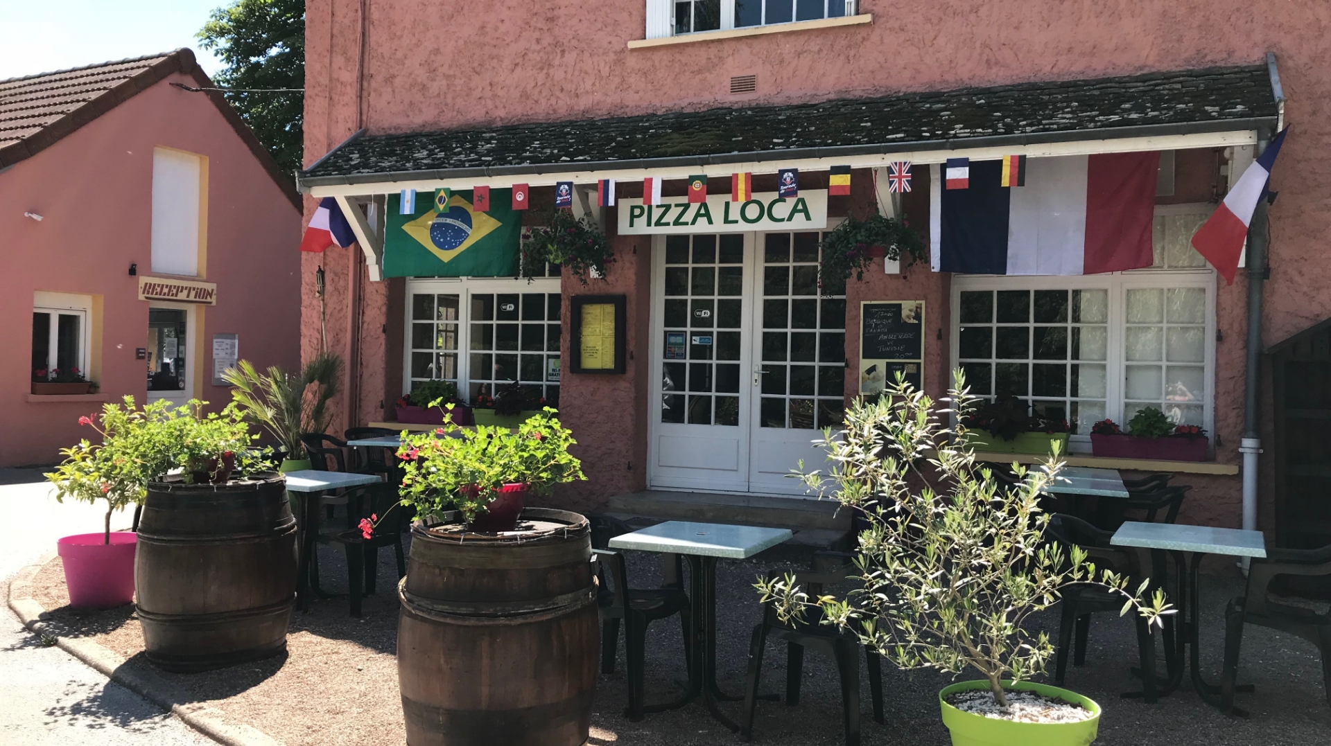 Exterior view of the restaurant at Le Paquier Fané campground in Burgundy, Chagny, a nature getaway