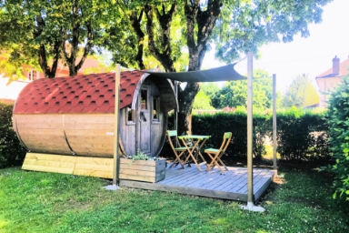 Exterior view of the barrel: unusual accommodation available to rent at Le Paquier Fané campsite in Saône-et-Loire